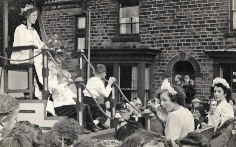 Jean Westbury sitting on the righ looking to the side