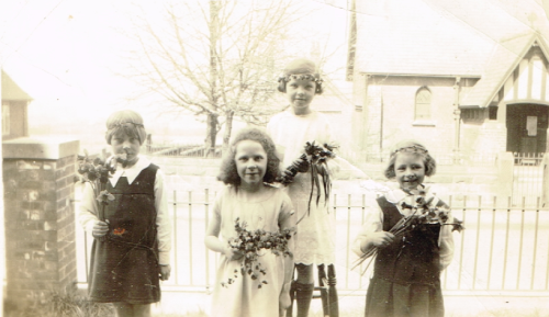 4 girls outside St.John's Church.